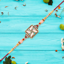 Designer Rakhi With Swastik-inspired Kundan Dial And Decorative Beads