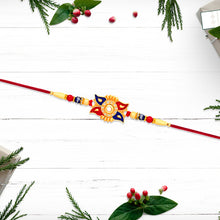 Designer Sun Motif Rakhi With Red And Blue Enamel Work